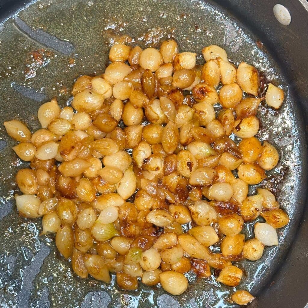 Caramelized pearl onions in pan
