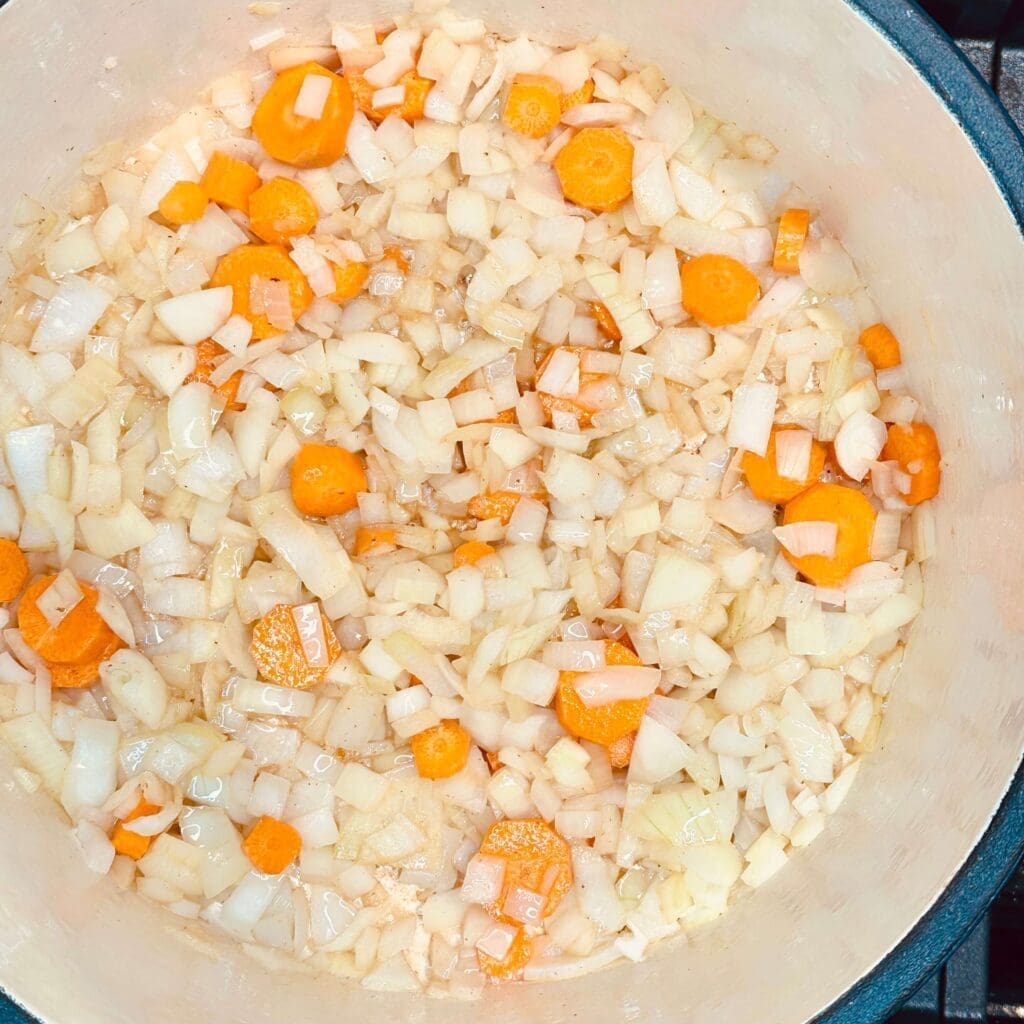 Chopped onions and carrots cooking