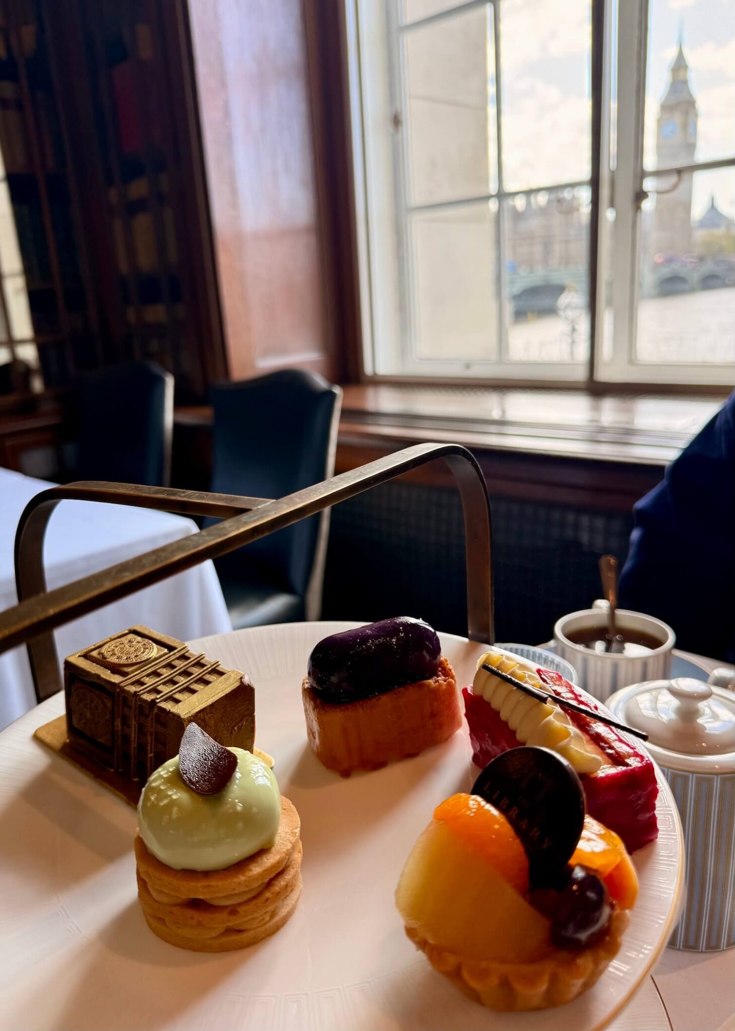 Afternoon Tea and Tower Bridge Views: Our First Day Exploring London 5 desserts with Big Ben in background