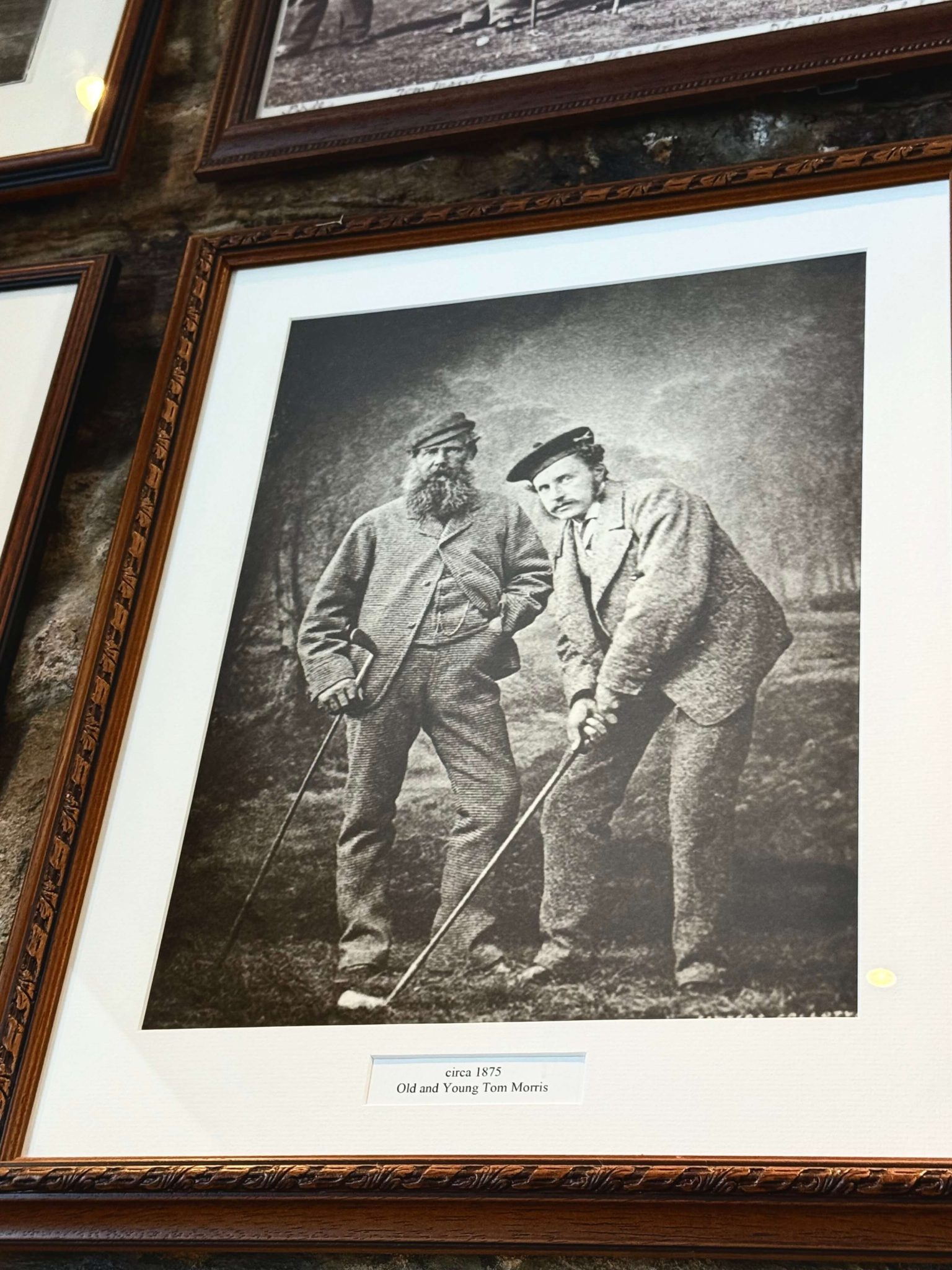 black and white photo of golfers st andrews